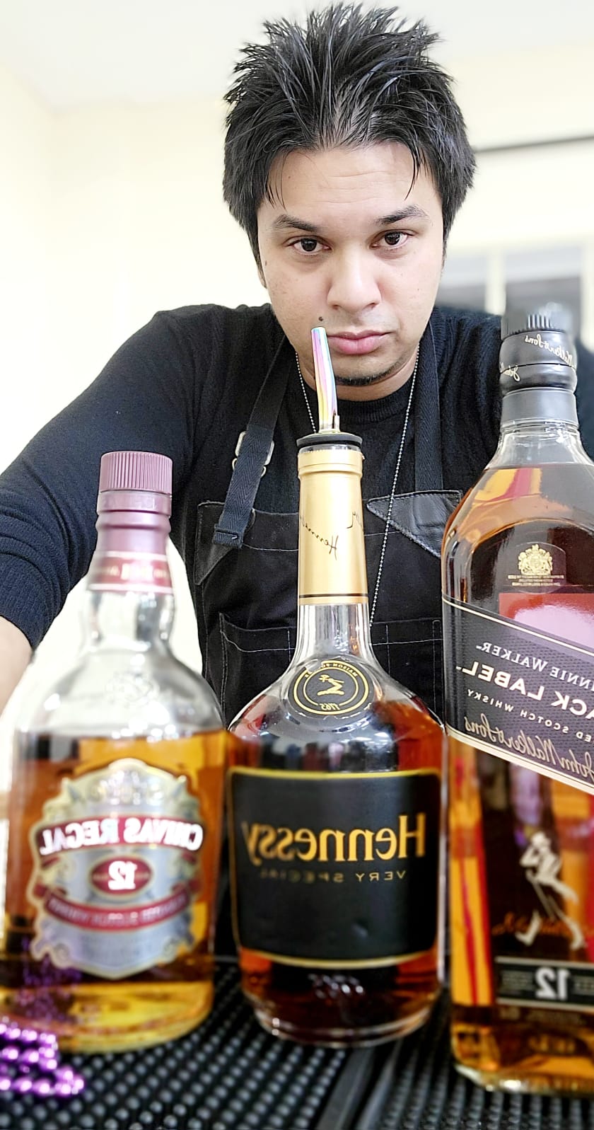 Top-shelf line-up — Hennessy, Chivas, JW