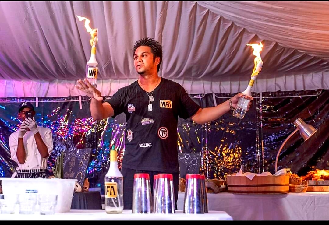Saied Ali performing flair bartending in Trinidad